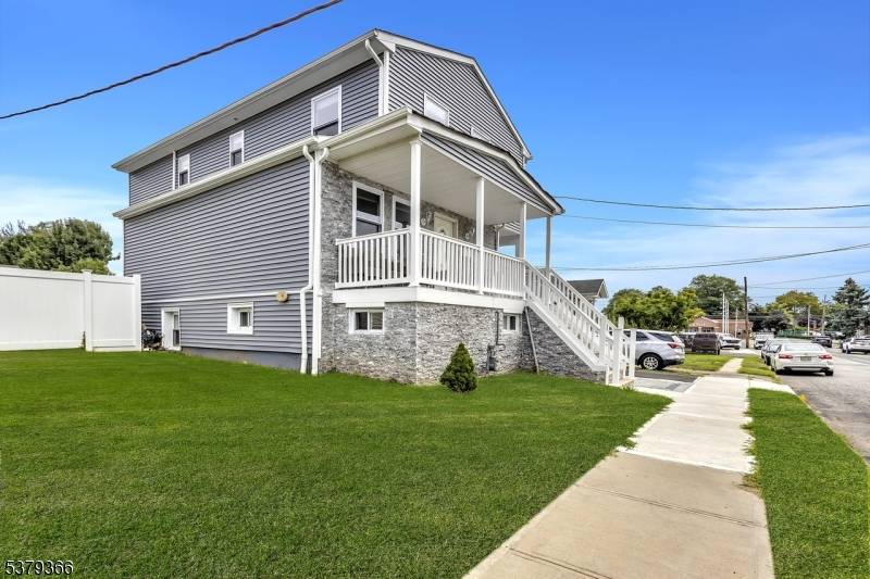 This updated Colonial Style home complete with a front porch, has been thoughtfully redesigned from roof to basement, offering style, functionality, and comfort throughout.