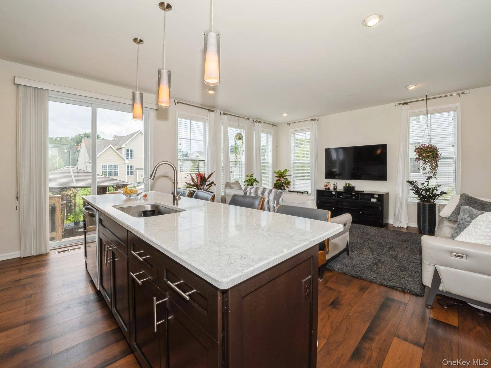 Designer inspired townhome with top quality finishes in highly sought after Hopewell Glen !