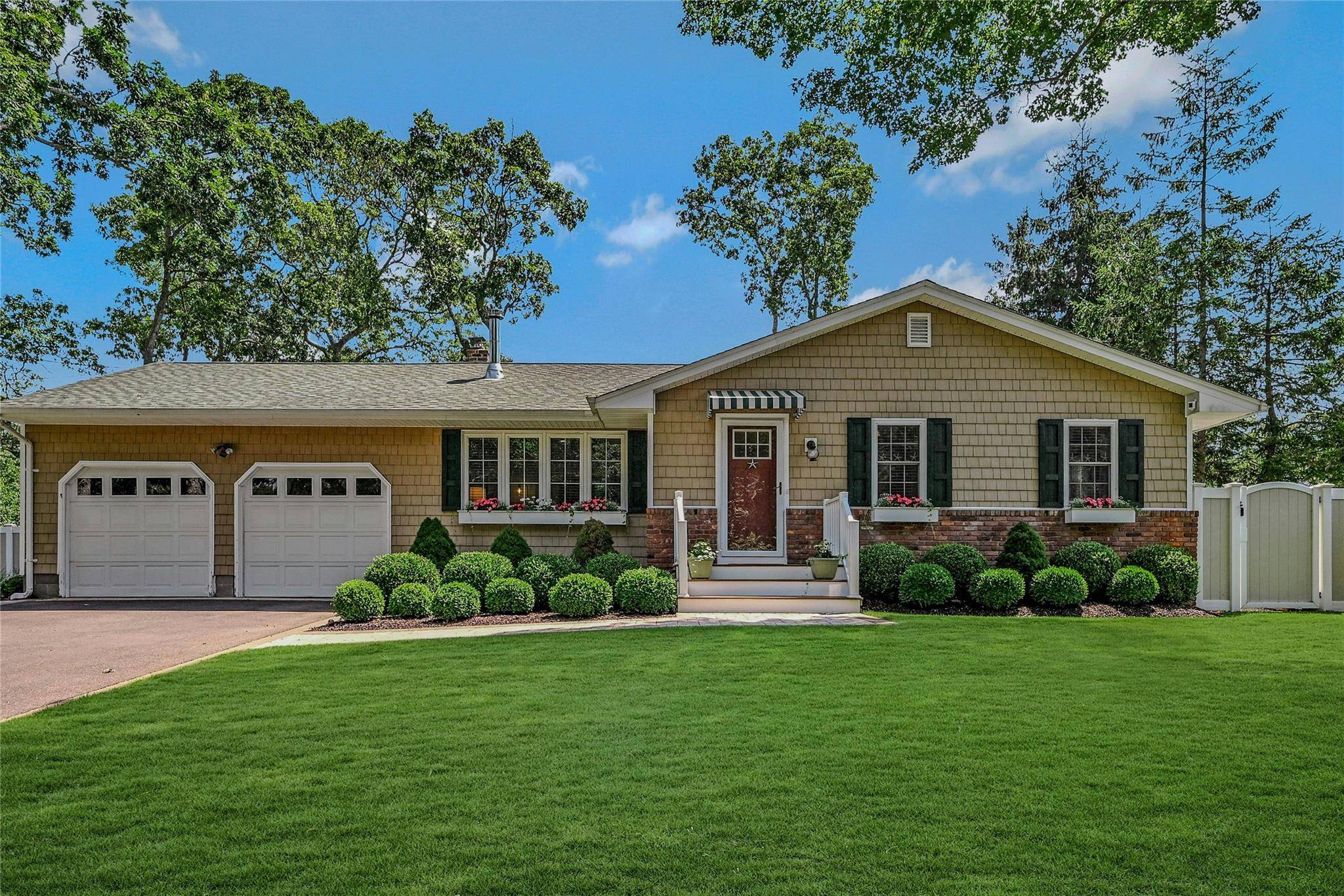 Welcome to 18 N Westbury Rd, Hampton Bays NY, a stunning home that perfectly captures the essence of chic Hamptons living.