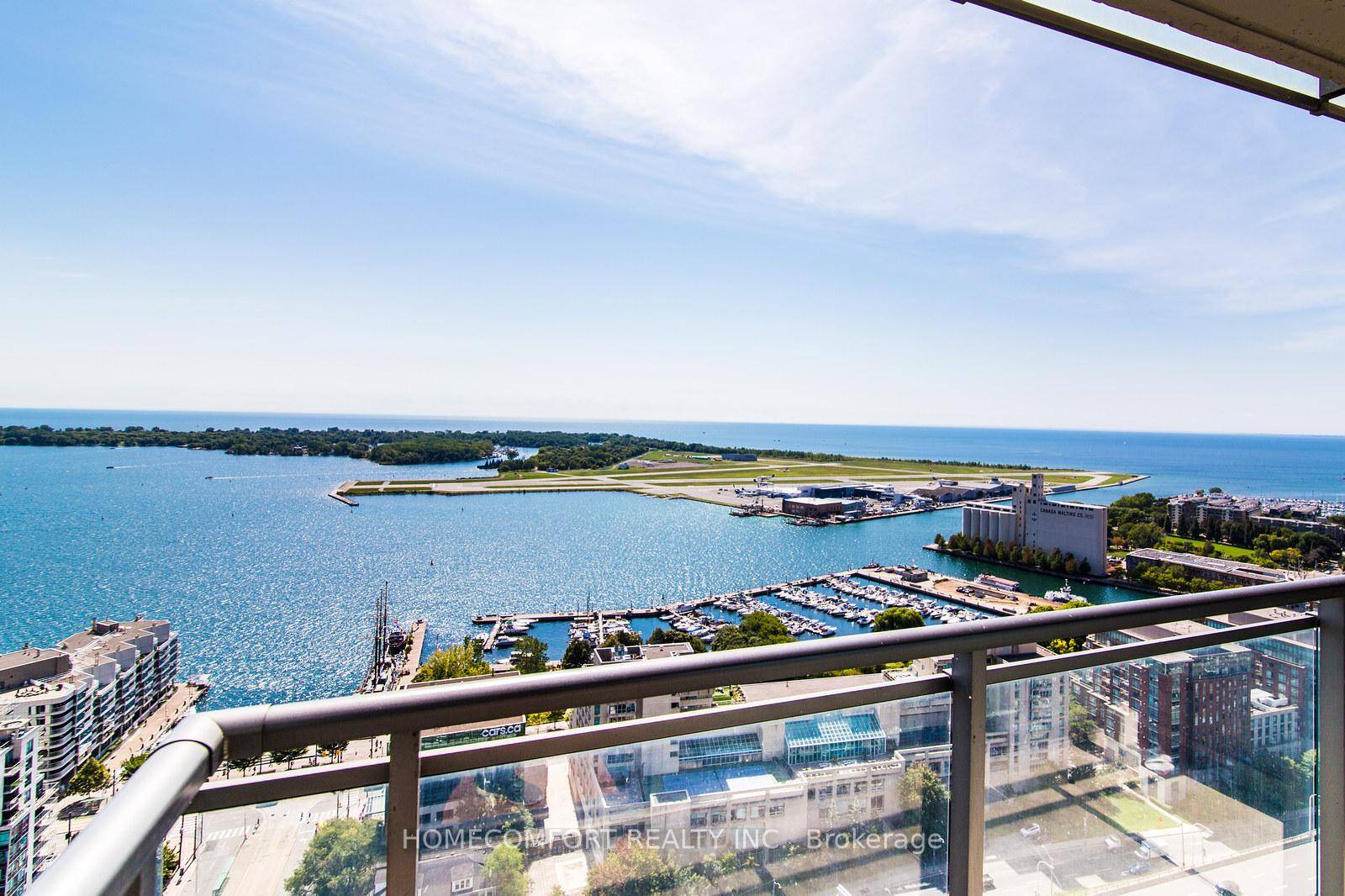 Spacious amp ; sun drenched south facing unit In downtown prime location, with stunning non obstructed views of Lake Ontario and Central Island from living room, bedroom and balcony.