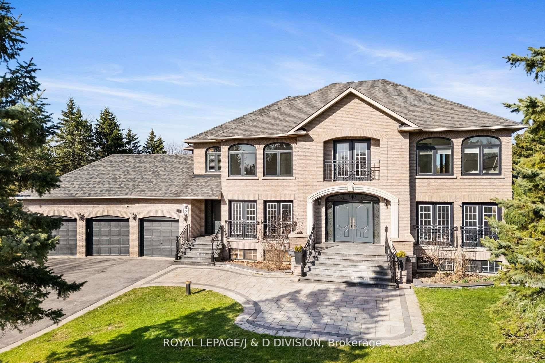 An elegant, estate style family residence nestled on a prestigious 1.