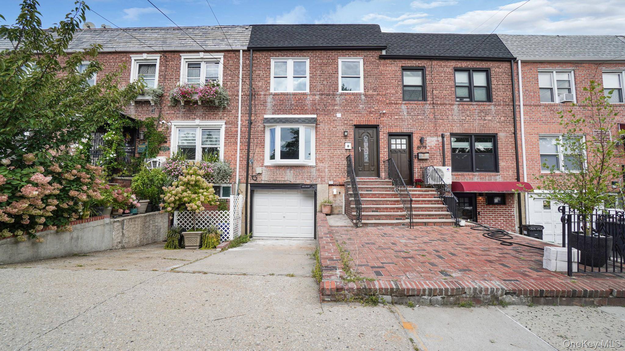 Don't miss this exceptional, fully renovated brick home in Jamaica !