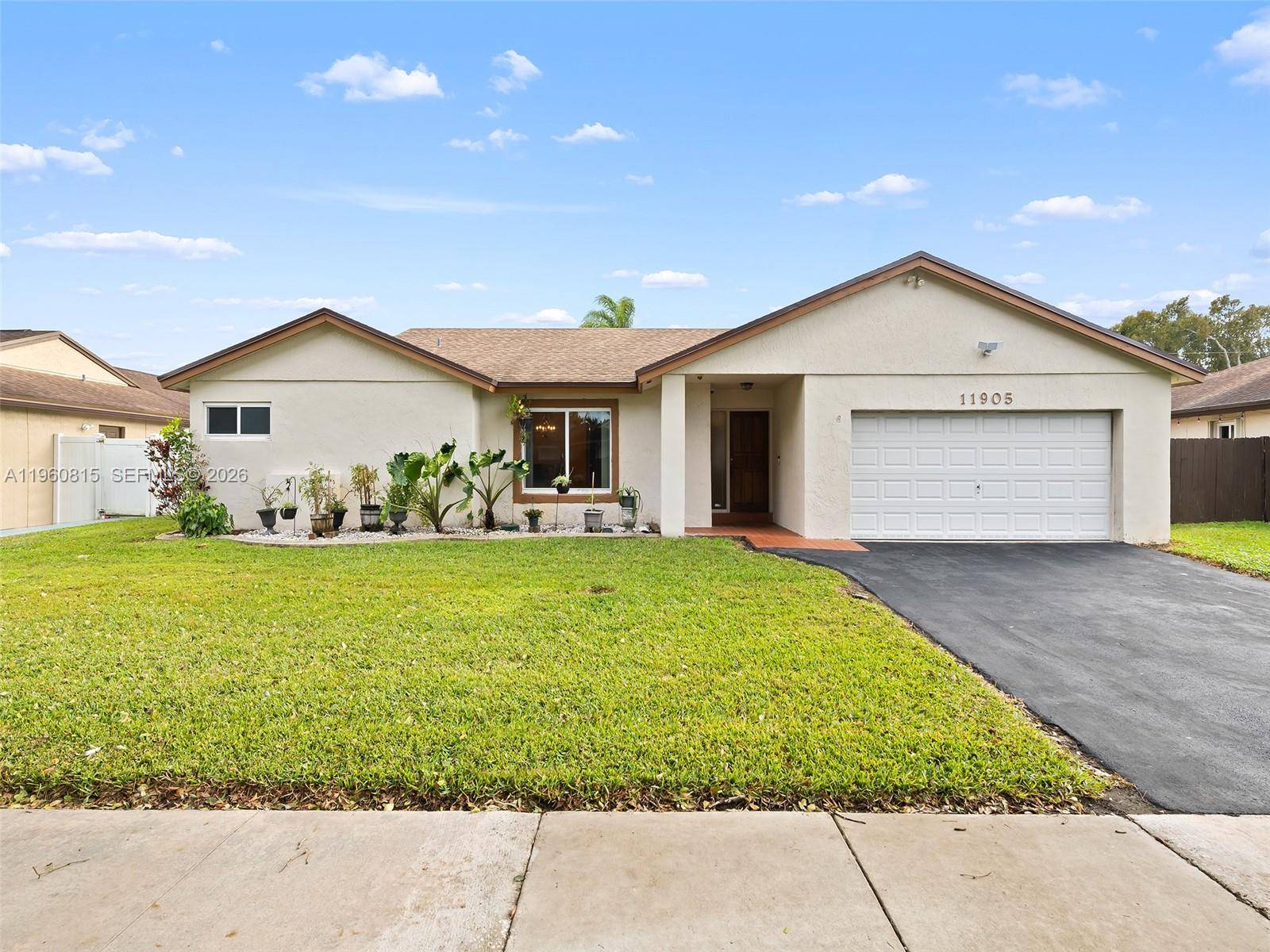 Welcome to this bright and airy Flamingo Gardens home in the heart of Cooper City.