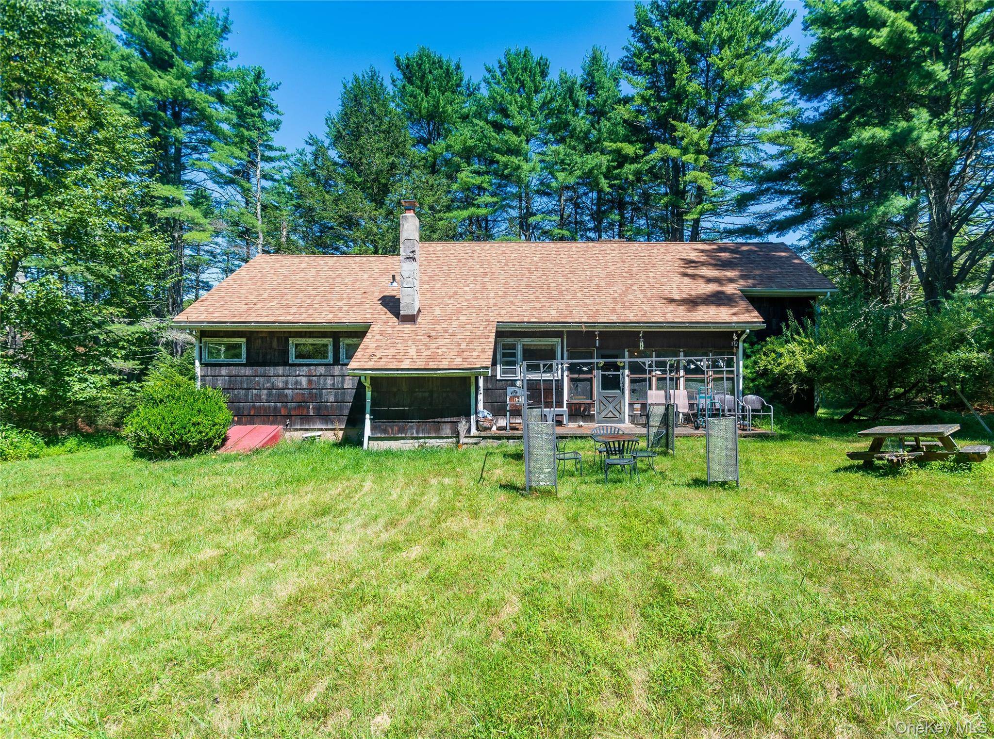 A storybook stream front retreat on nearly 17 acres of complete privacy, this enchanting three bedroom, one bath home offers a serene escape surrounded by nature.