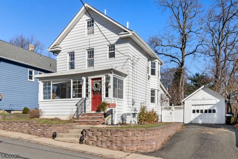 Welcome to 22 Mott Place, a well maintained Colonial offering classic character, natural light, and a versatile layout in Rockaway Borough.