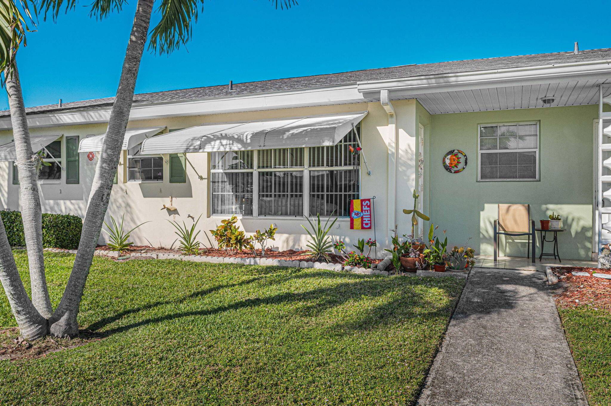 When you step into this immaculate Furnished condo, in this gated senior complex, you'll notice the Tropical look that the owner has created.