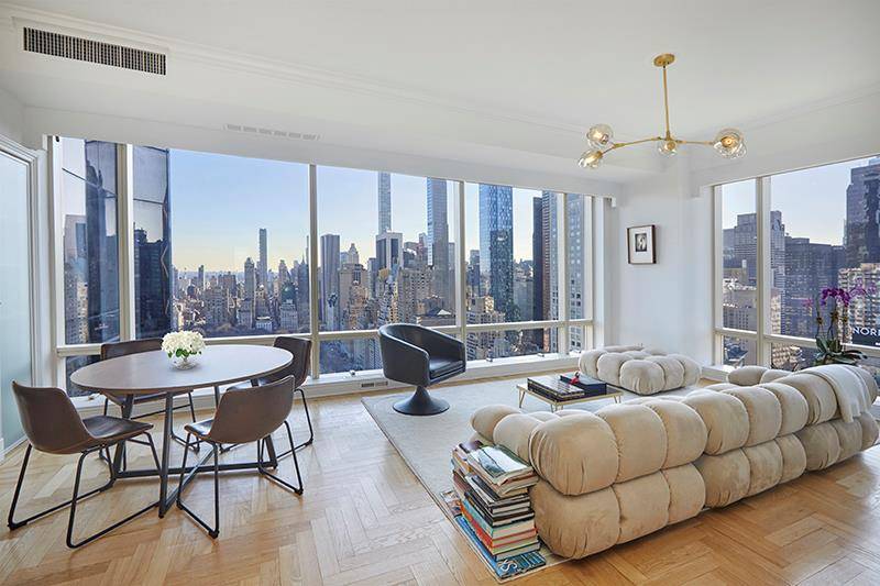 Perched high above Central Park, this spectacular and rarely available three bedroom, three and a half bath residence offers breathtaking views of Central Park and iconic New York City skyline.