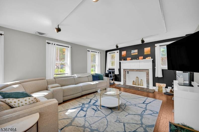 Sitting back off the road majestically, old world charm meets modern updates and conveniences throughout this lovely pre 1900s Colonial in a most bucolic 3 acre setting.