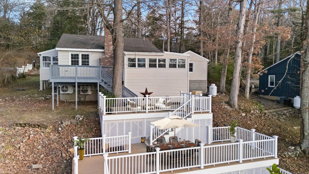 Brand new multi level TimberTech decks spanning roughly 800 square feet anchor the back of this fully furnished and beautifully renovated lakeside home on private Witches Woods Lake, creating an ...