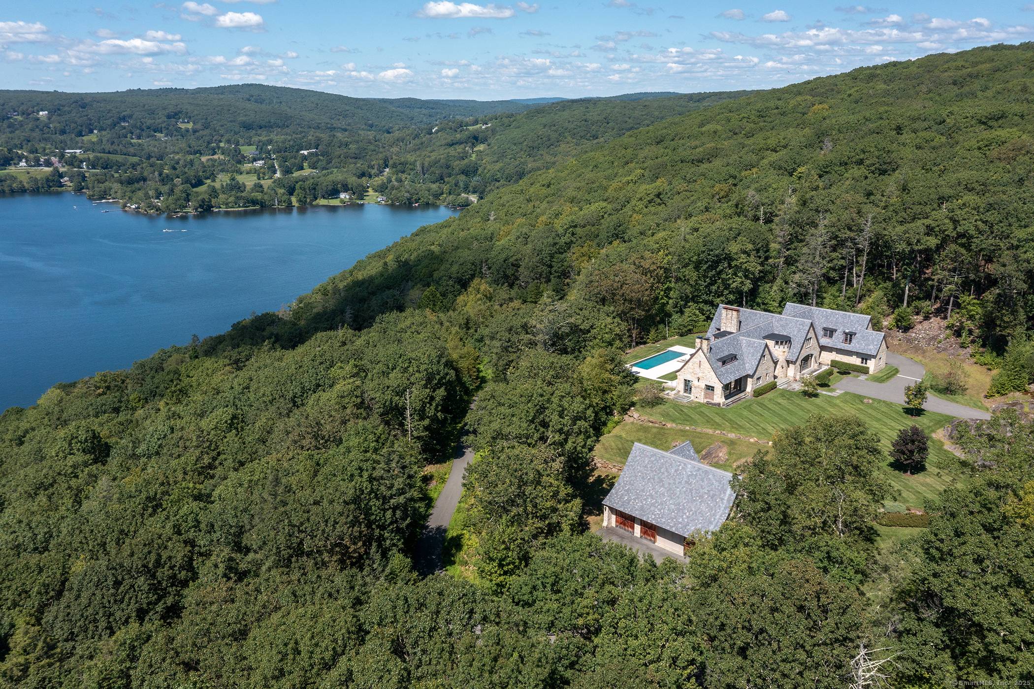 Unparalleled custom built modern estate on 30 acres with jaw dropping views overlooking Lake Waramaug with 100' of lake frontage dock.