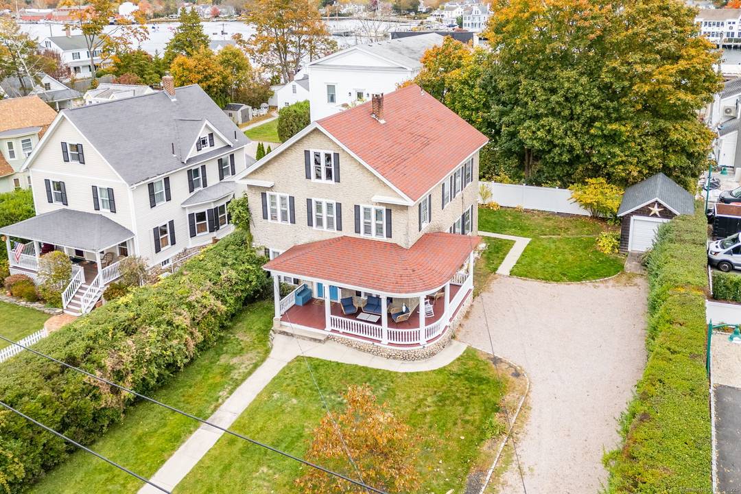 Step into coastal New England charm at 8 Pearl Street a spacious, beautifully maintained colonial style home just a short stroll from downtown Mystic !