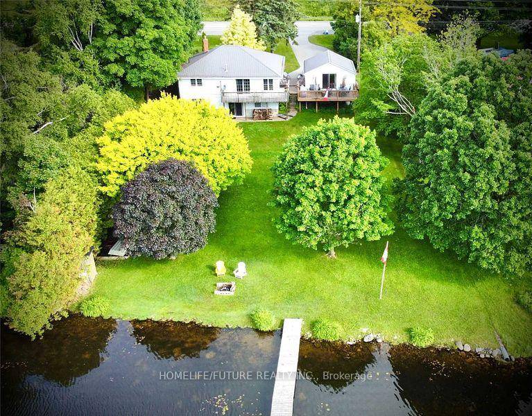This year round 2 2 bedroom home on Mitchell Lake offers stunning southern exposure with panoramic water views from nearly every room, featuring an open concept kitchen with modern cabinetry, ...