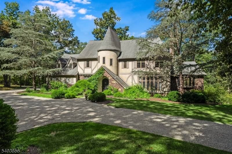 Tucked away in picturesque Far Hills, within an hour of Manhattan, this updated French Normandy Tudor style residence, set on 14 acres, is a rare architectural gem, blending storybook charm ...