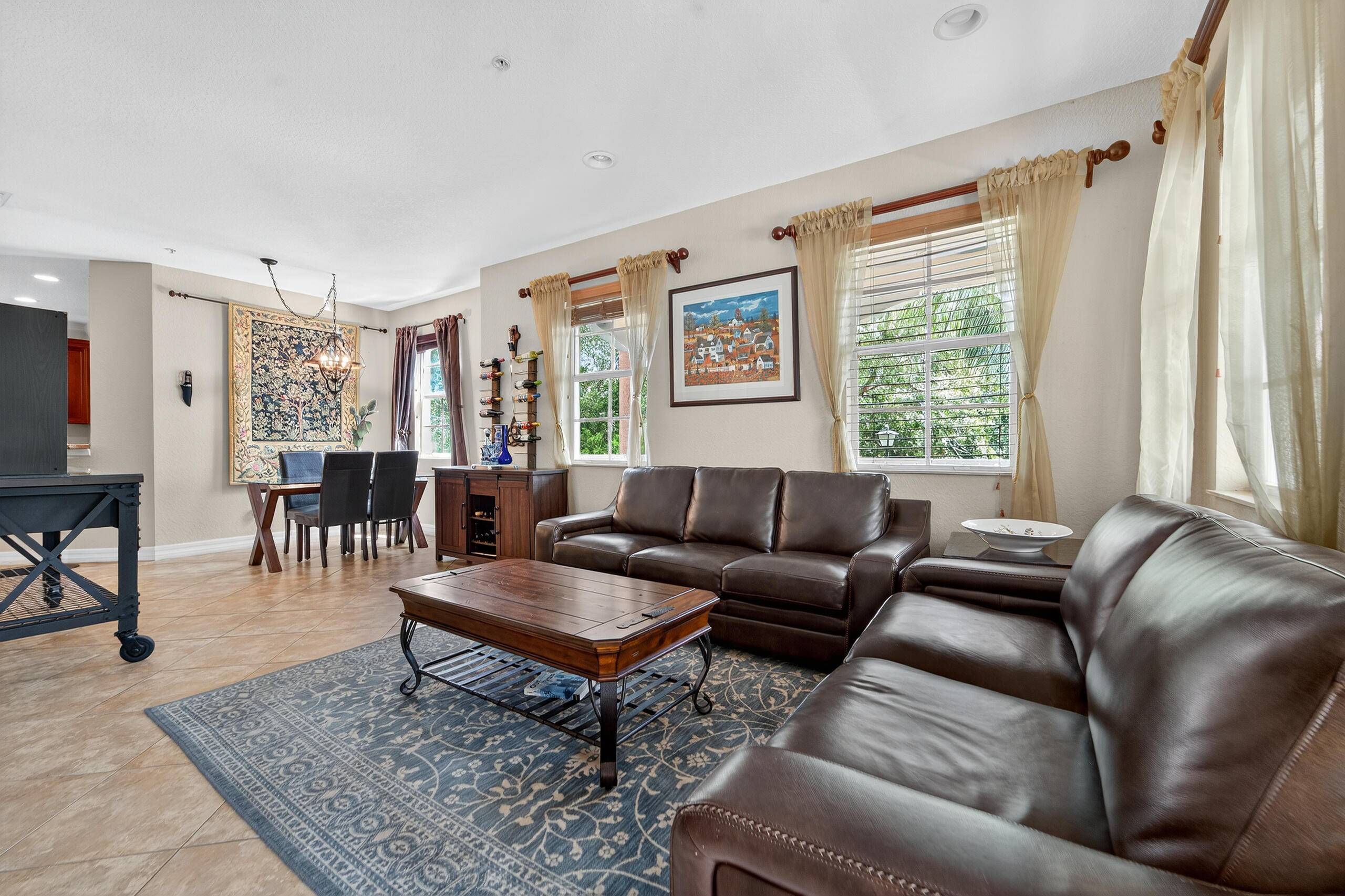 Spacious 3 bed, 4 bath end unit townhouse with 2 car garage in sought after Botanica.