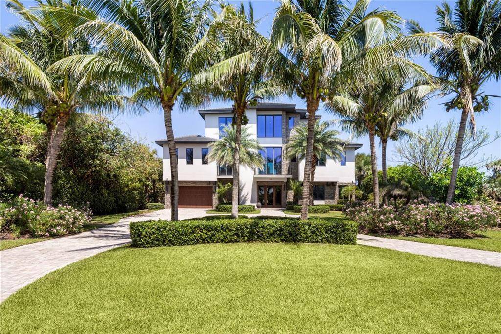 The largest estate in the community, this oceanfront masterpiece spans nearly an acre with rare ocean to river views.