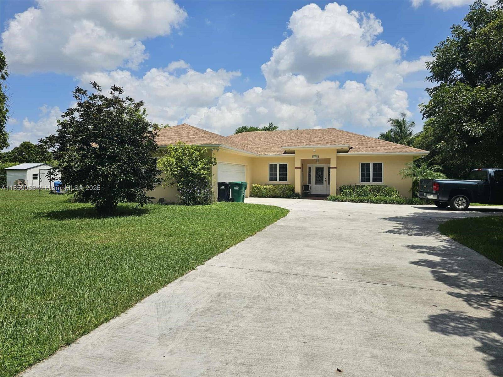 Affordable Redland living on a fenced corner lot with room for a pool and RV boat parking.