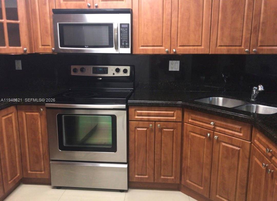 Nice and well located 2 bedroom apartment with two bathroom, tile floors, granite counter tops, stainless steel appliances, new washer and dryer, patio.