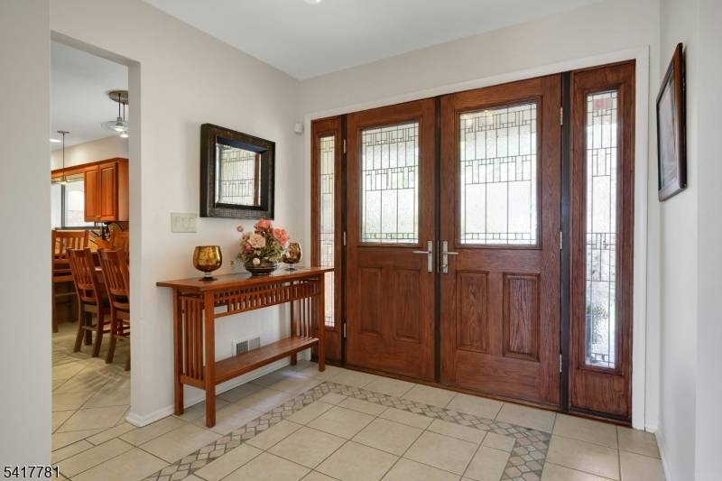 This custom home is filled with amazing natural light offers beautiful views exceptional privacy.