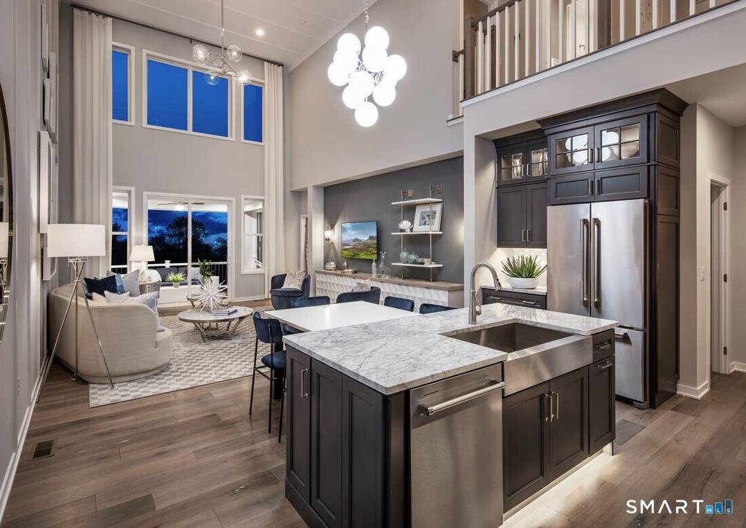 This is the Pierpont Elite Modern Farmhouse a two story townhome with primary bedroom on the main floor and two bedrooms up and a loft.