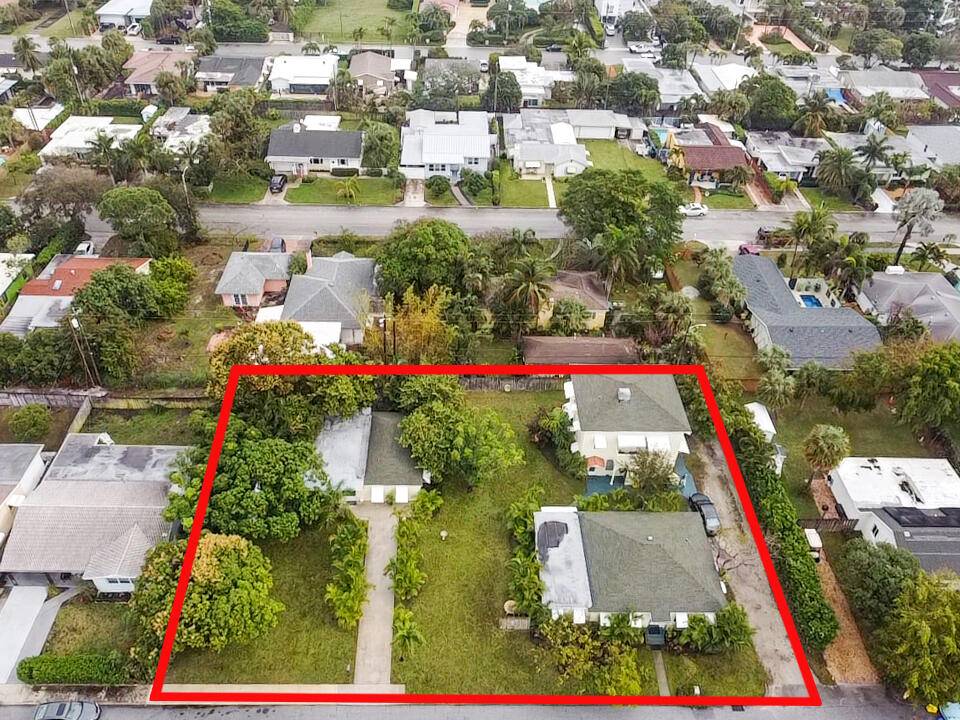 Seize a rare and distinctive opportunity to own a lucrative multi family residential income property nestled on three buildable lots, merely a block away from the intracoastal.