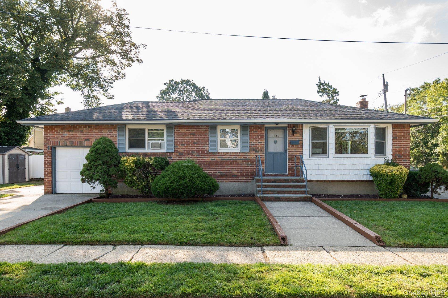 Beautifully maintained 3 Bedroom 2 Full Bath Ranch in desirable East Meadow, Hard wood floors throughout.