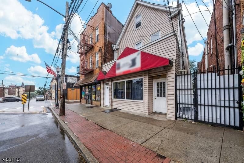 4 Unit Mixed Use Property in the Historic Botany Village Section of Clifton with all Separate Utilities, Brand New Roof and NO RENT CONTROL.