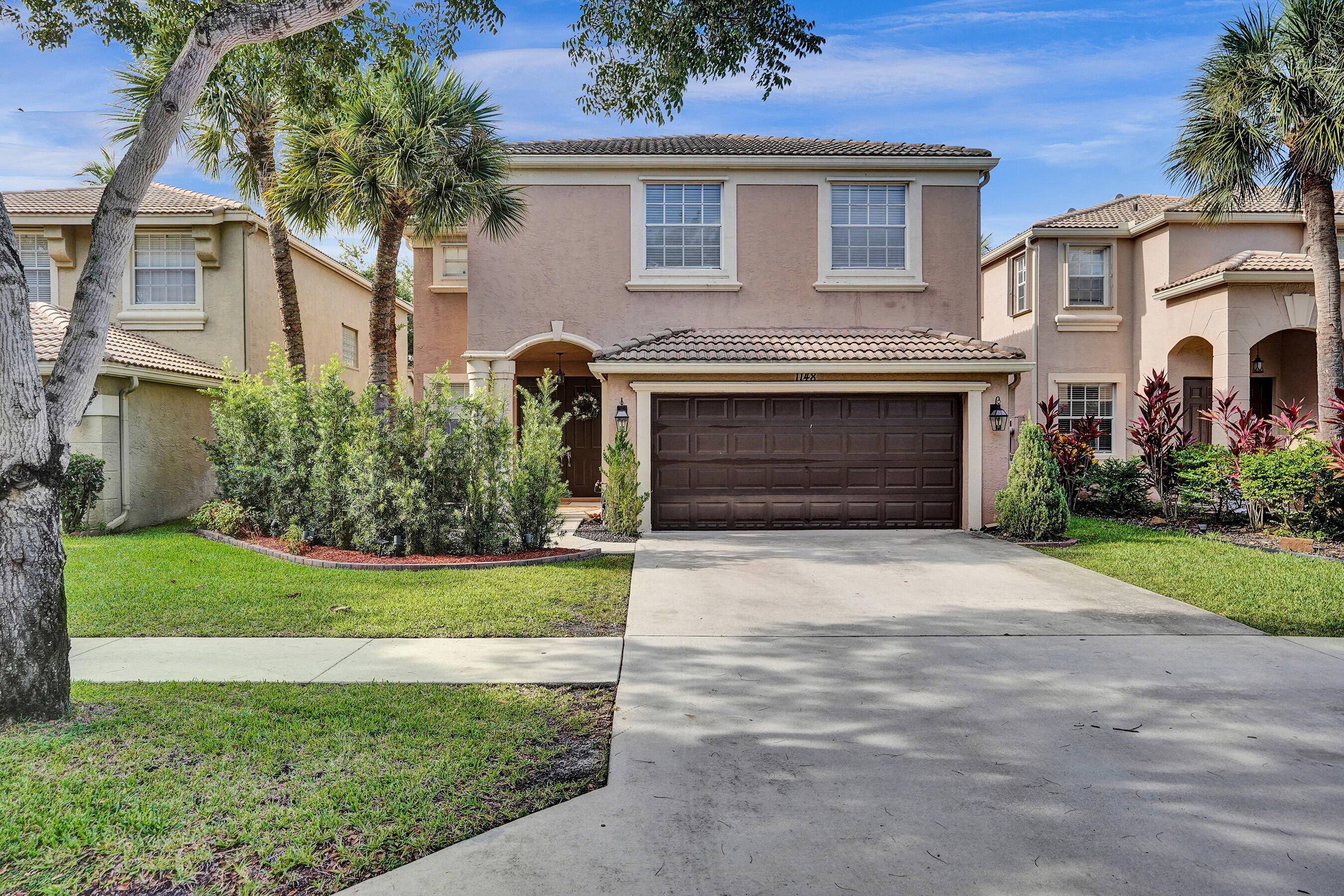 Located on a quiet, tree lined street and surrounded by lush, mature landscaping, this stunning 5 bedroom Florida home offers breathtaking golf and water views.