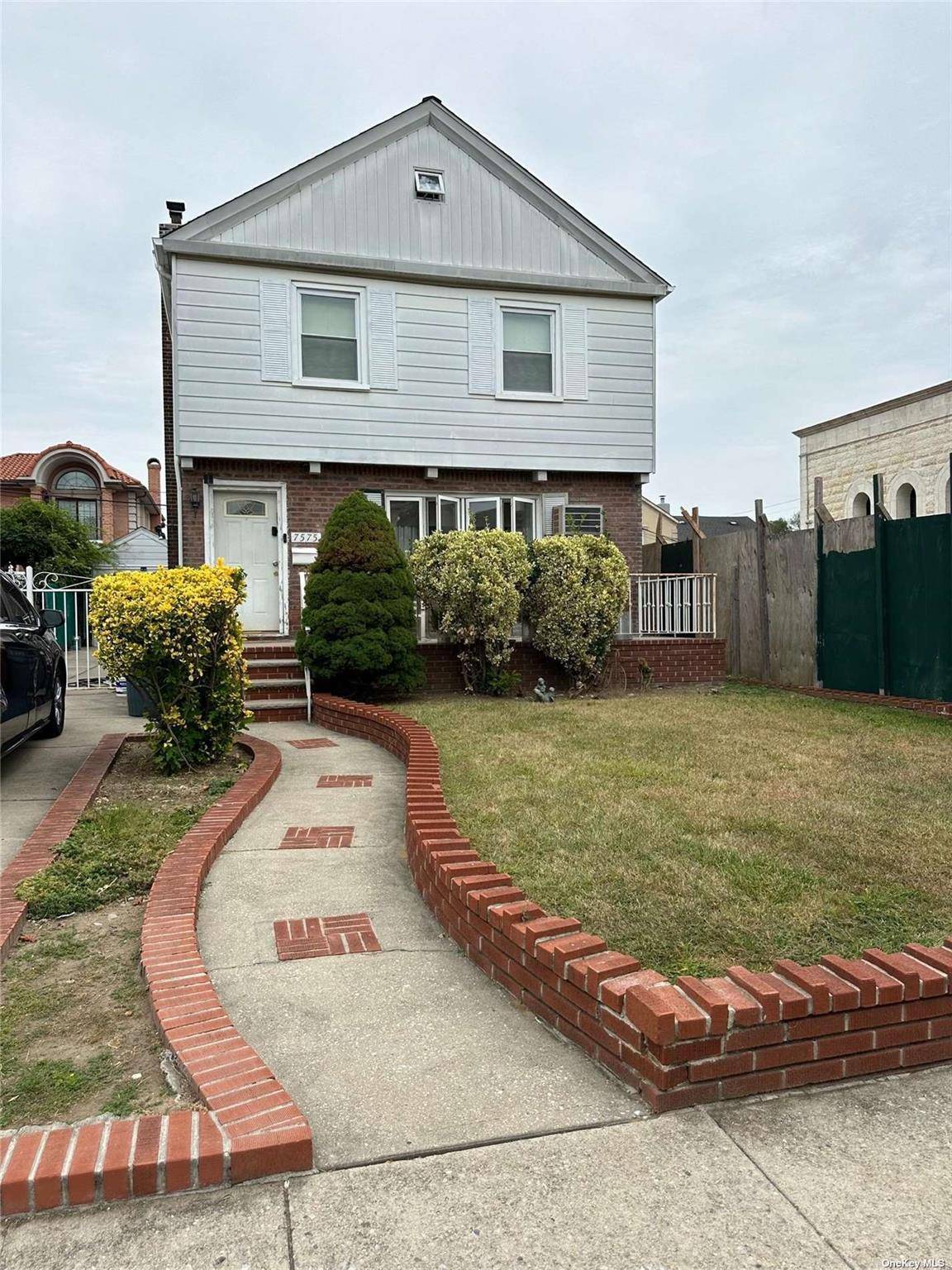 Detached colonial brick house in the heart of Fresh Meadows.