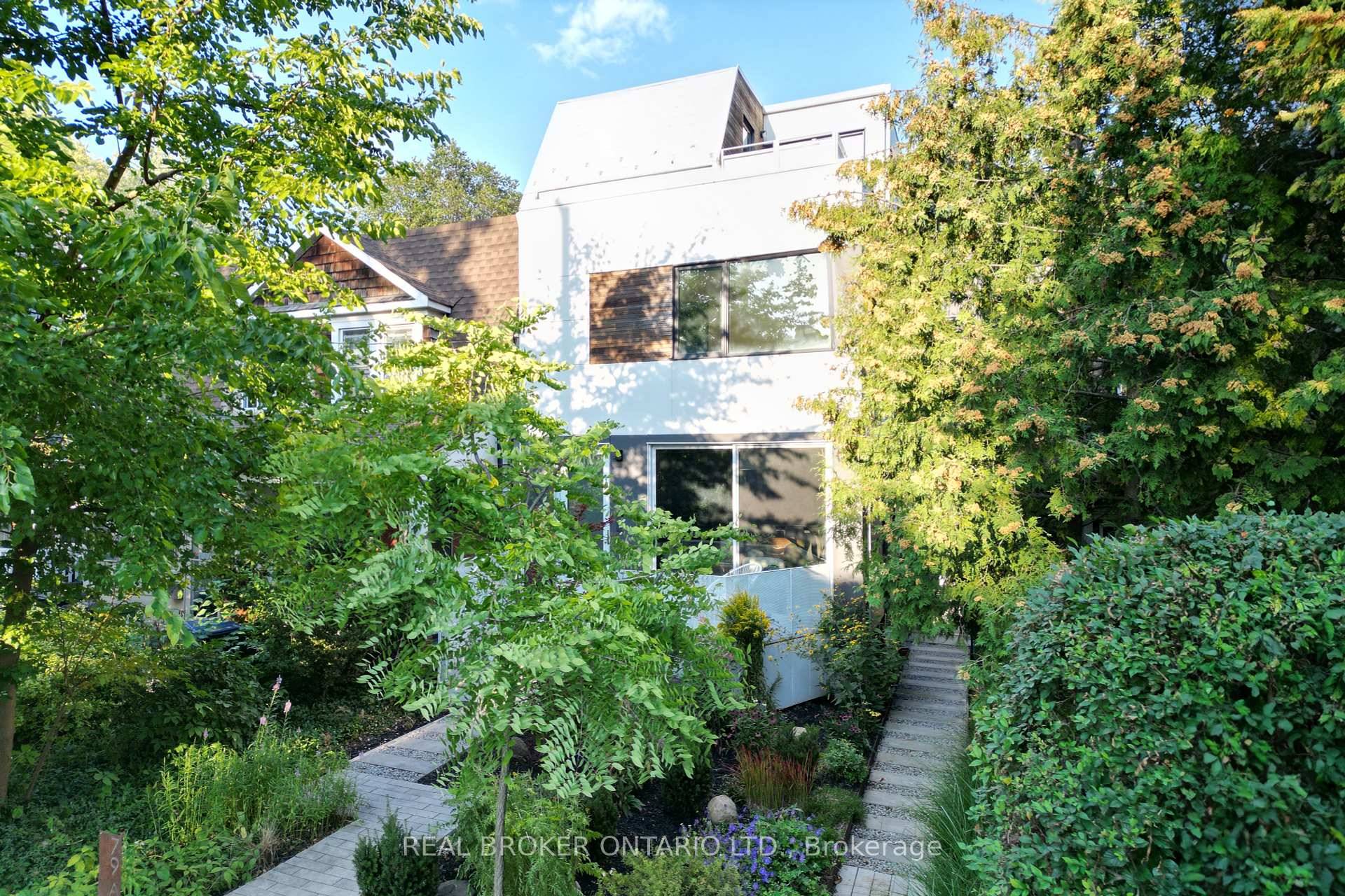 Veer off Danforth, up one way Eaton Ave to find a visually striking, modern 3 storey structure of two distinct properties that fit together like pieces of a puzzle.