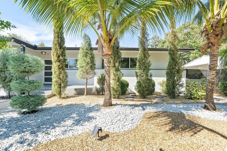 Fully upgraded residence ideally located steps from Miami s Design District, offering a rare blend of privacy, modern elegance, and prime urban access.