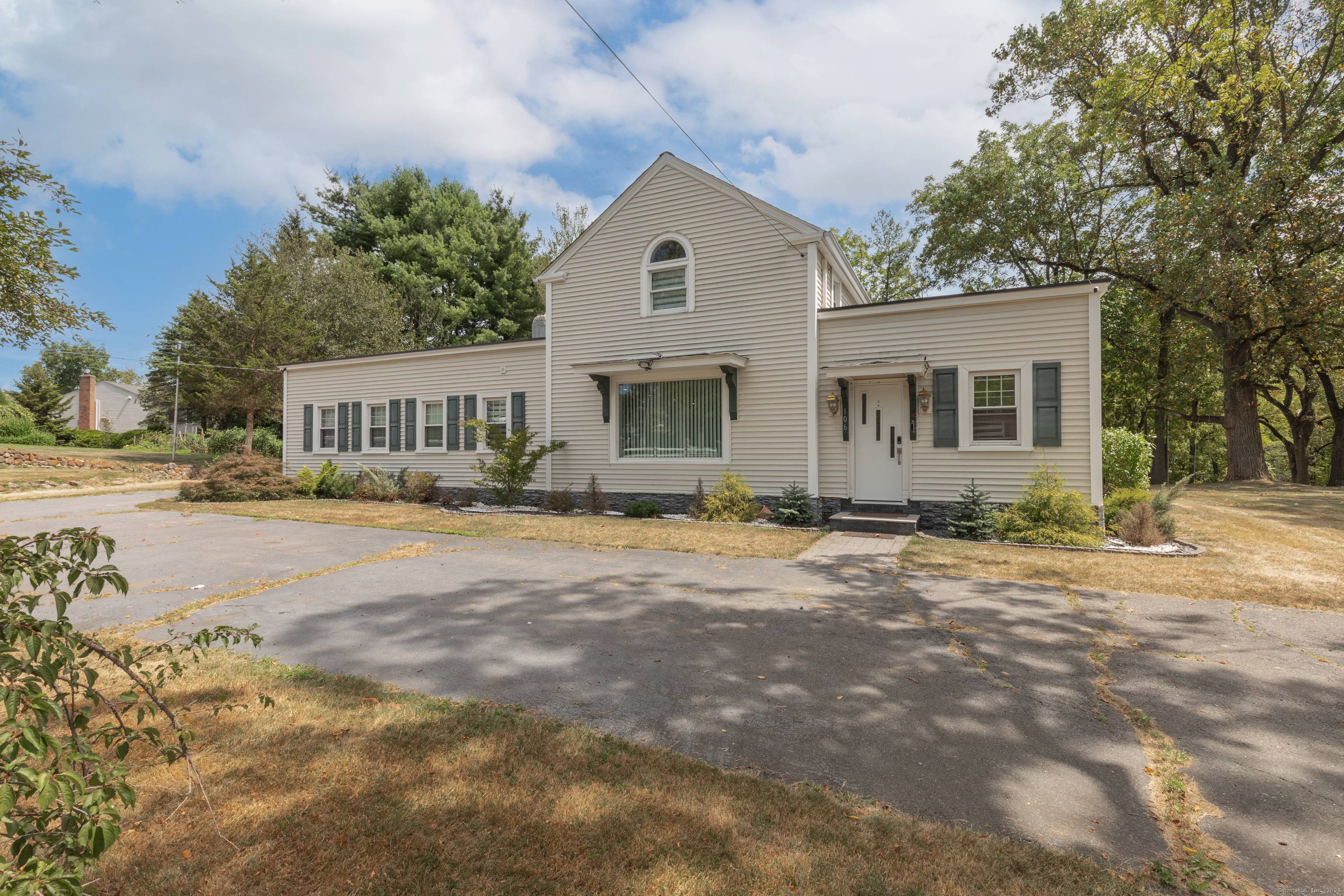 Welcome to this inviting three bedroom, two bathroom Colonial set in a picturesque neighborhood that blends classic character with modern updates.