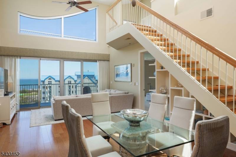 This two story penthouse is exceptional at every level with a glamorous vibe in a beach chic way.