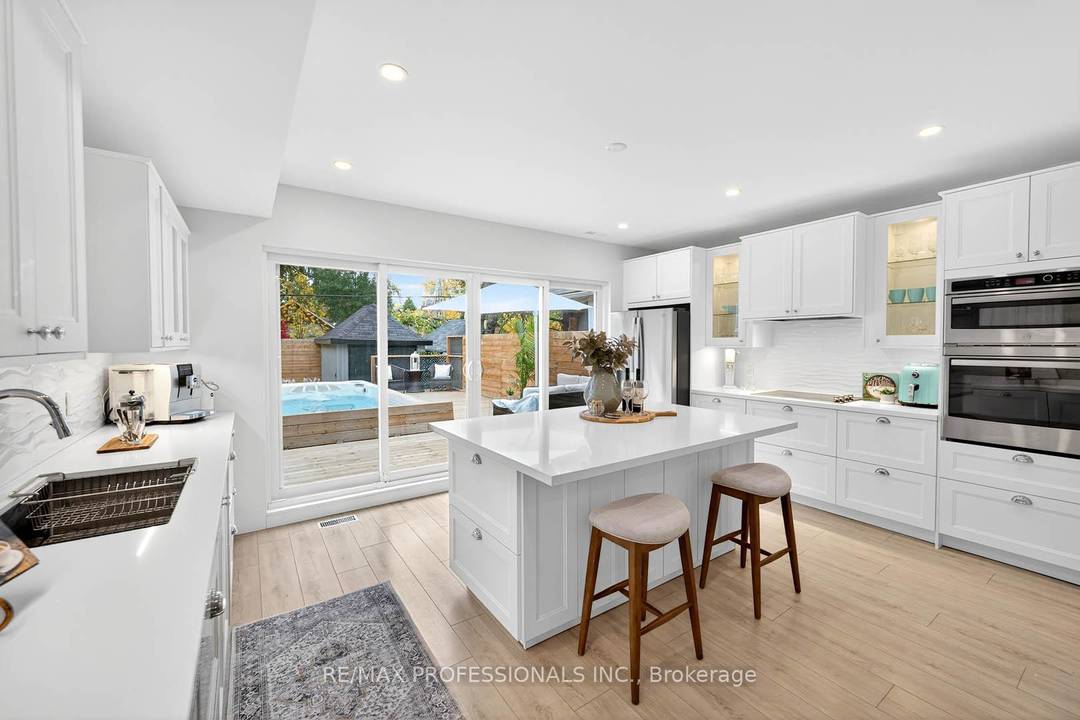 Stunning 3 Story rebuilt modern home steps to the Lake !