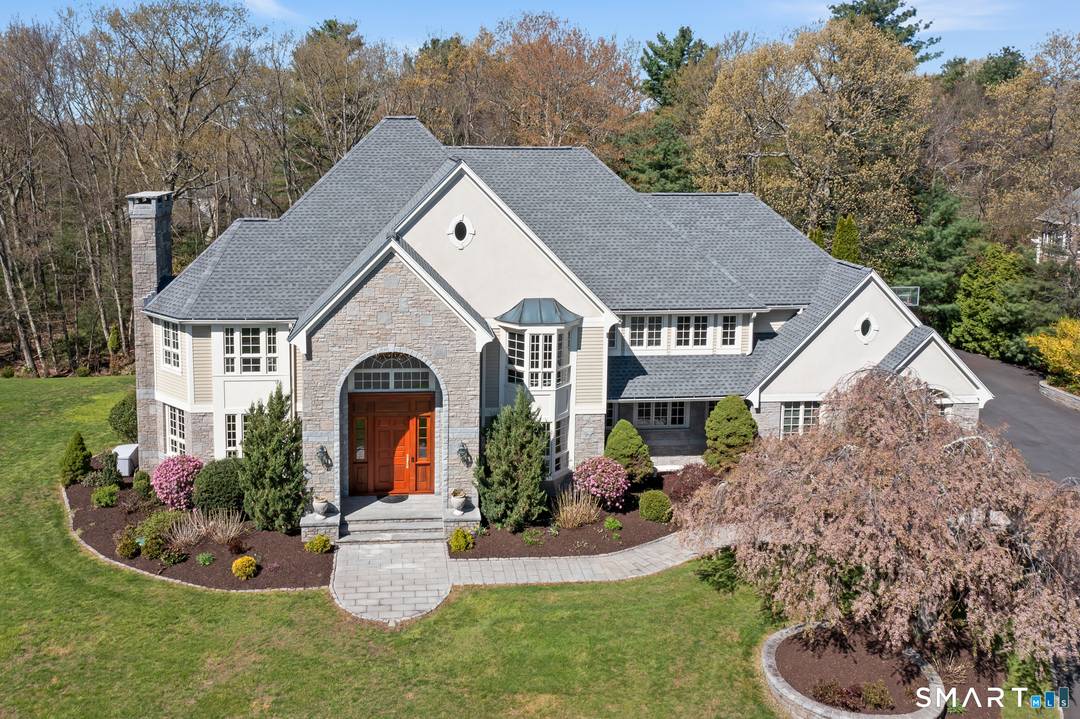 Spectacular custom home, lovingly curated, BEAUTIFULLY maintained and often admired, is set majestically on a private cul de sac in South Glastonbury's premier Kingswood Estates.