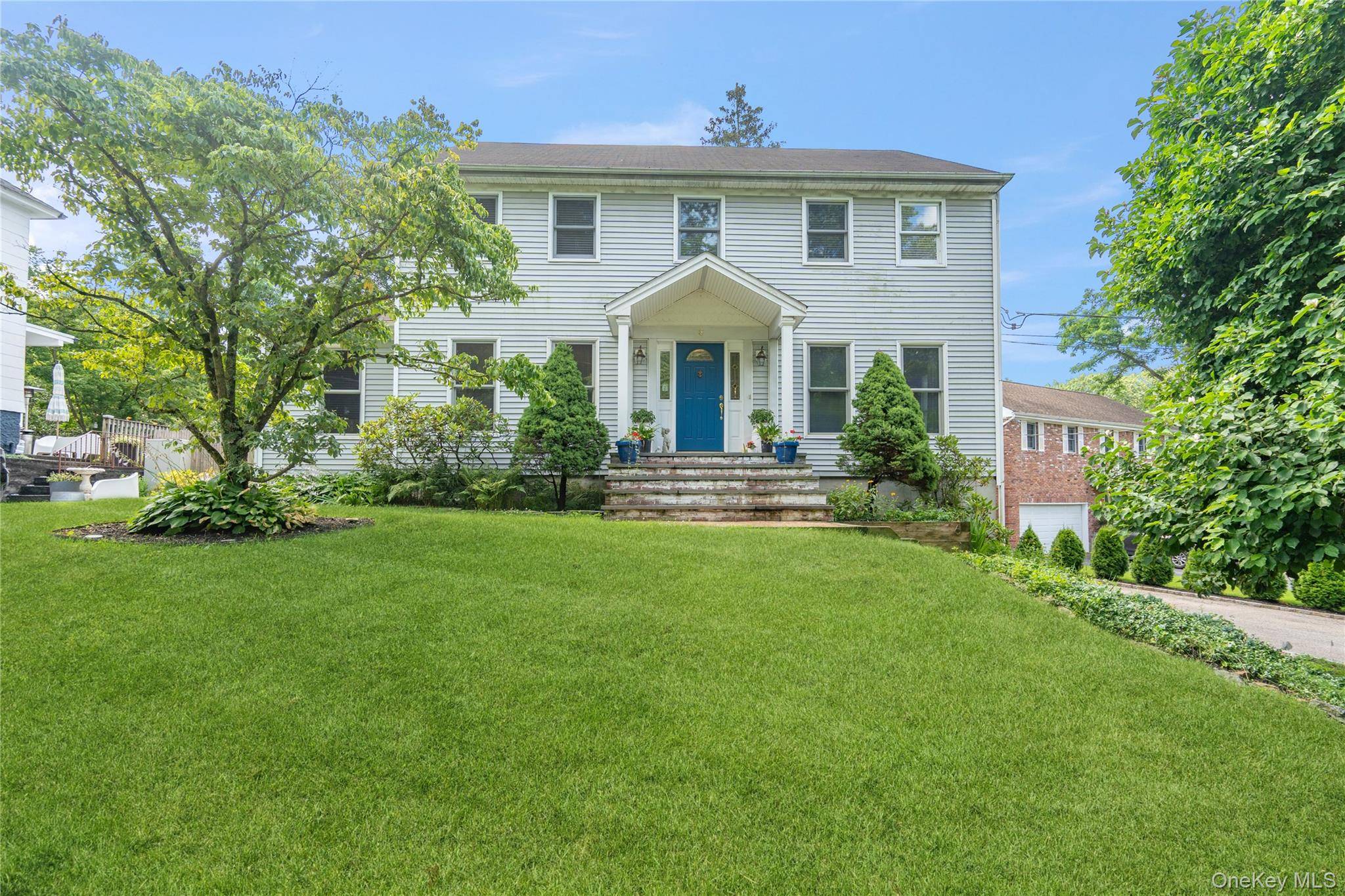 Welcome to 6 Cedar Ave, nestled in the tranquil and private locale of Locust Valley, NY, is a delightful 4 bedroom, 3 bathroom center hall colonial home.