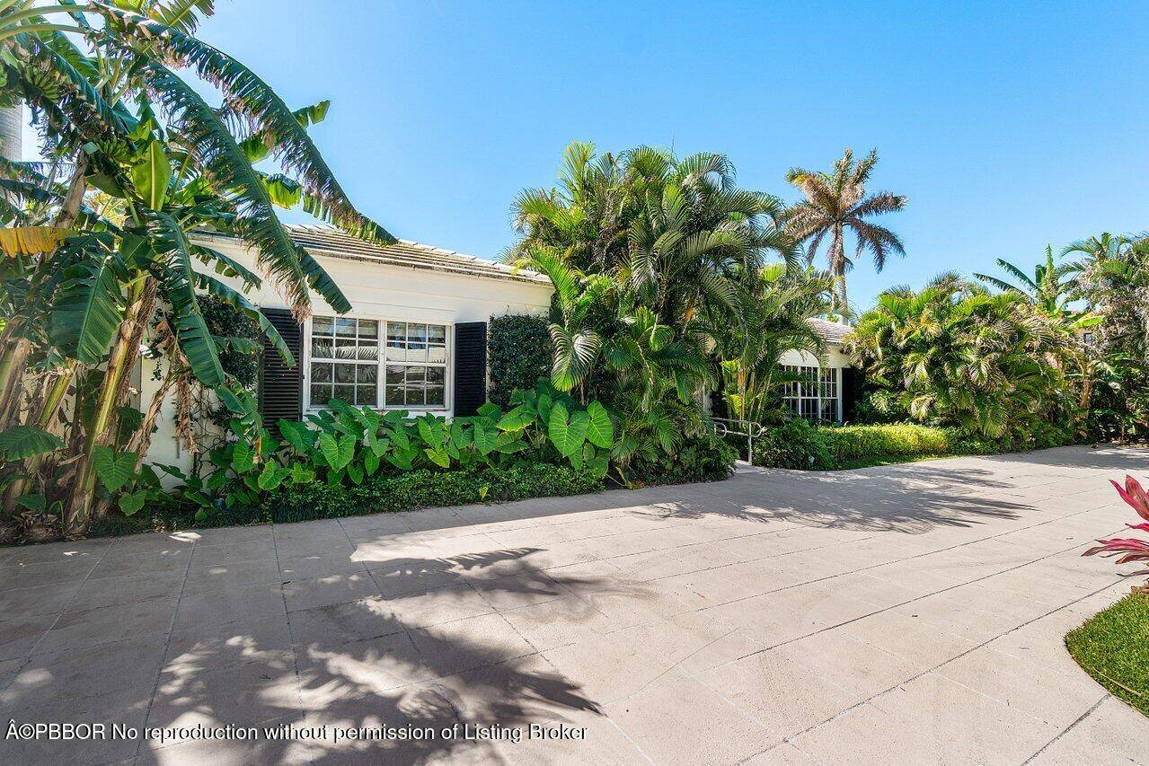 Prime location, Bermuda style home on a royal palm lined street on the North End of Palm Beach with a large lot, with rear access from Via Marila, and just ...