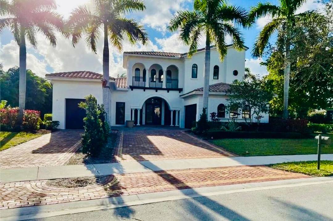 Welcome to a masterpiece of modern elegance set on a coveted double lakefront lot in Parkland's premier community.