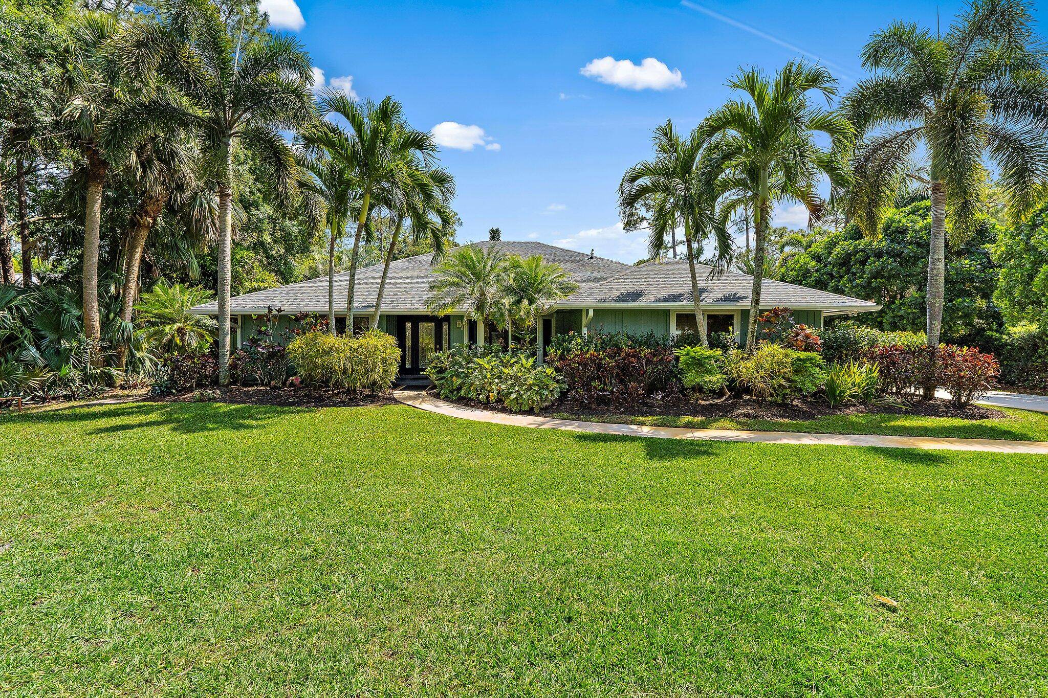 Set on a serene street in the highly desirable Trailwood community in Jupiter Farms, this 4 bedroom, den office, 3 bathroom home offers a rare mix of privacy, natural beauty, ...