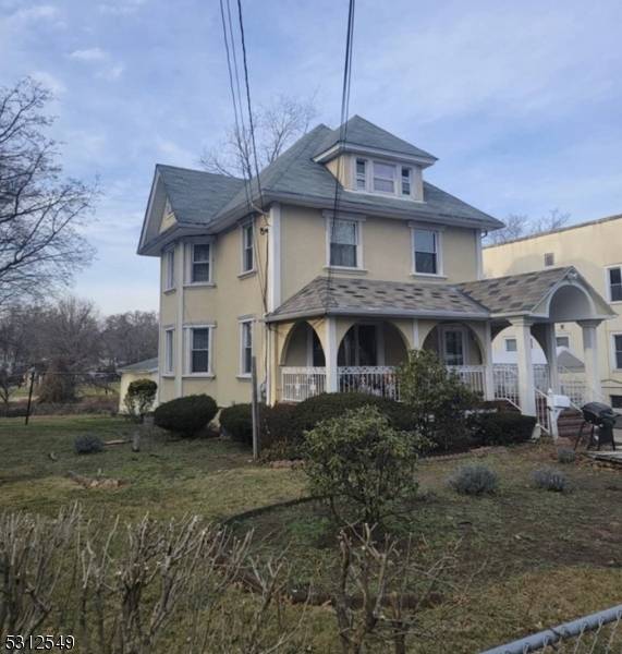 Stunning Colonial Home with Exquisite Front Porch, Finished basement, LONG DRIVEWAY WITH AMPLE PARKING, and an oversized lot.