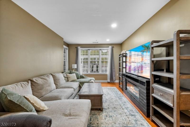Experience effortless living and modern elegance in this ground level condo at The Grande, offering rare convenience with no stairs or elevator required.