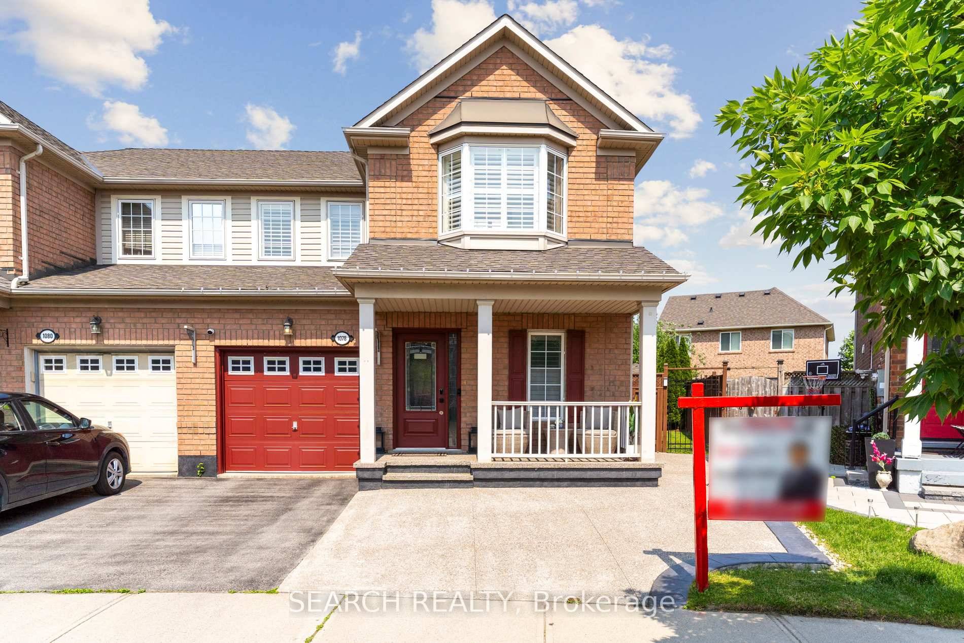 Welcome to 1078 Barclay Circle a standout semi that lives like a detached, set on a rare pie shaped lot that widens to 49.