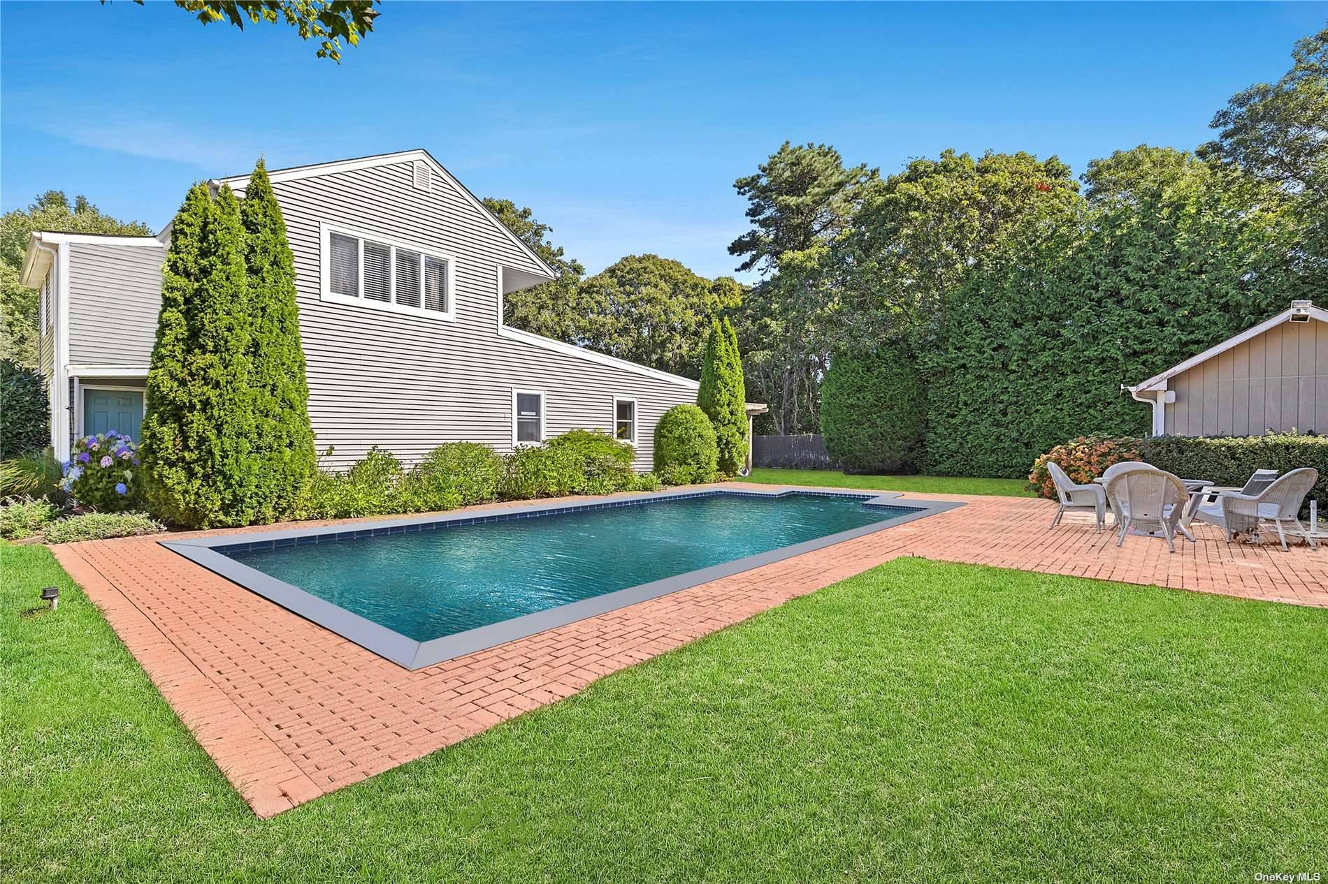Nestled down a private flag lot south of the highway, this well maintained five bedroom, three bathroom home is the epitome of a relaxed summer retreat.
