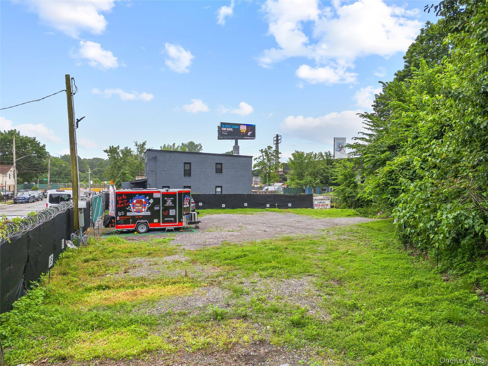 Extra large 2 family with 4 units and a GIANT 5, 704 square foot lot parking lot for 22 cars !