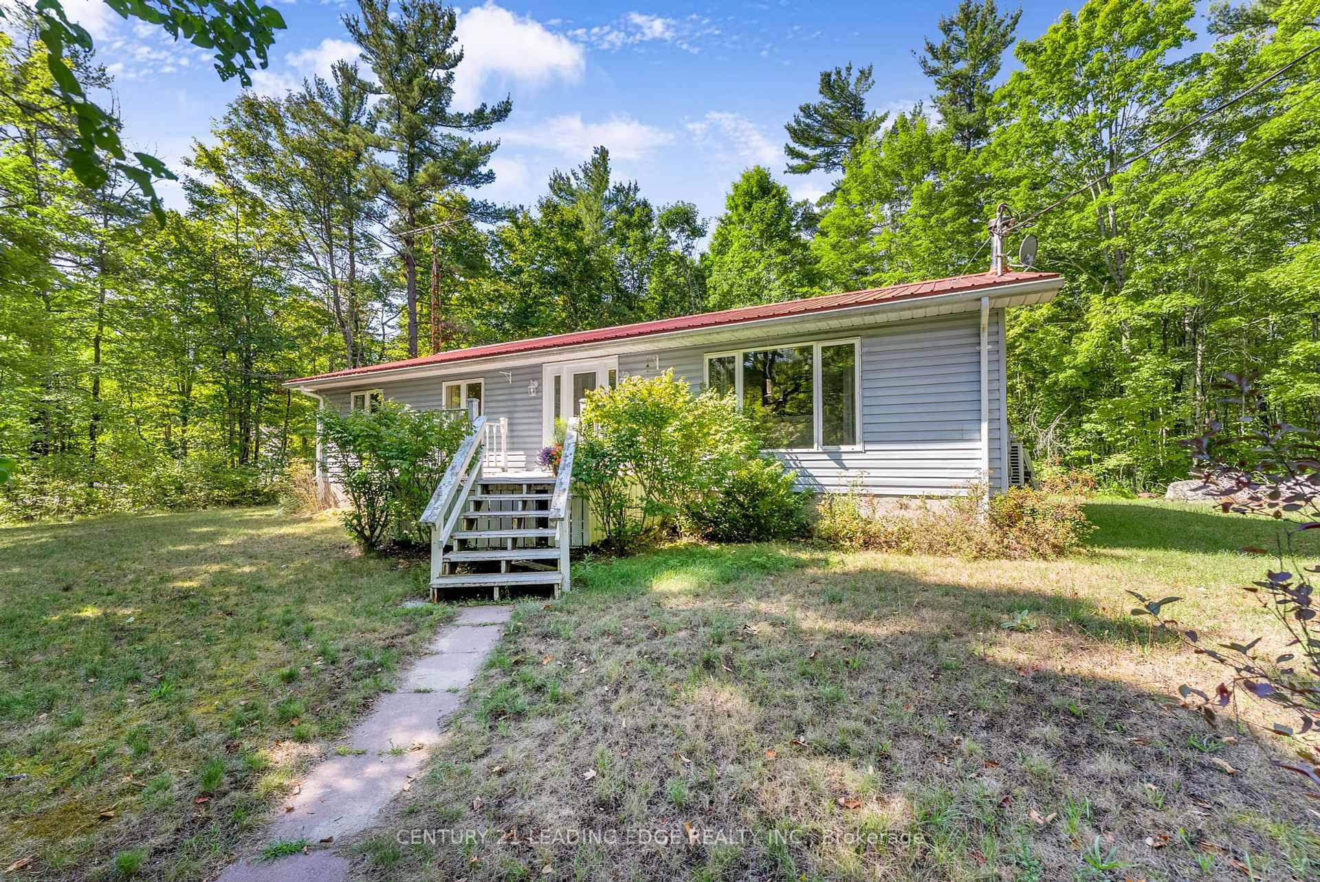 Charming 3 bedroom, 1 bath bungalow on a private 1 acre wooded lot in Madoc.