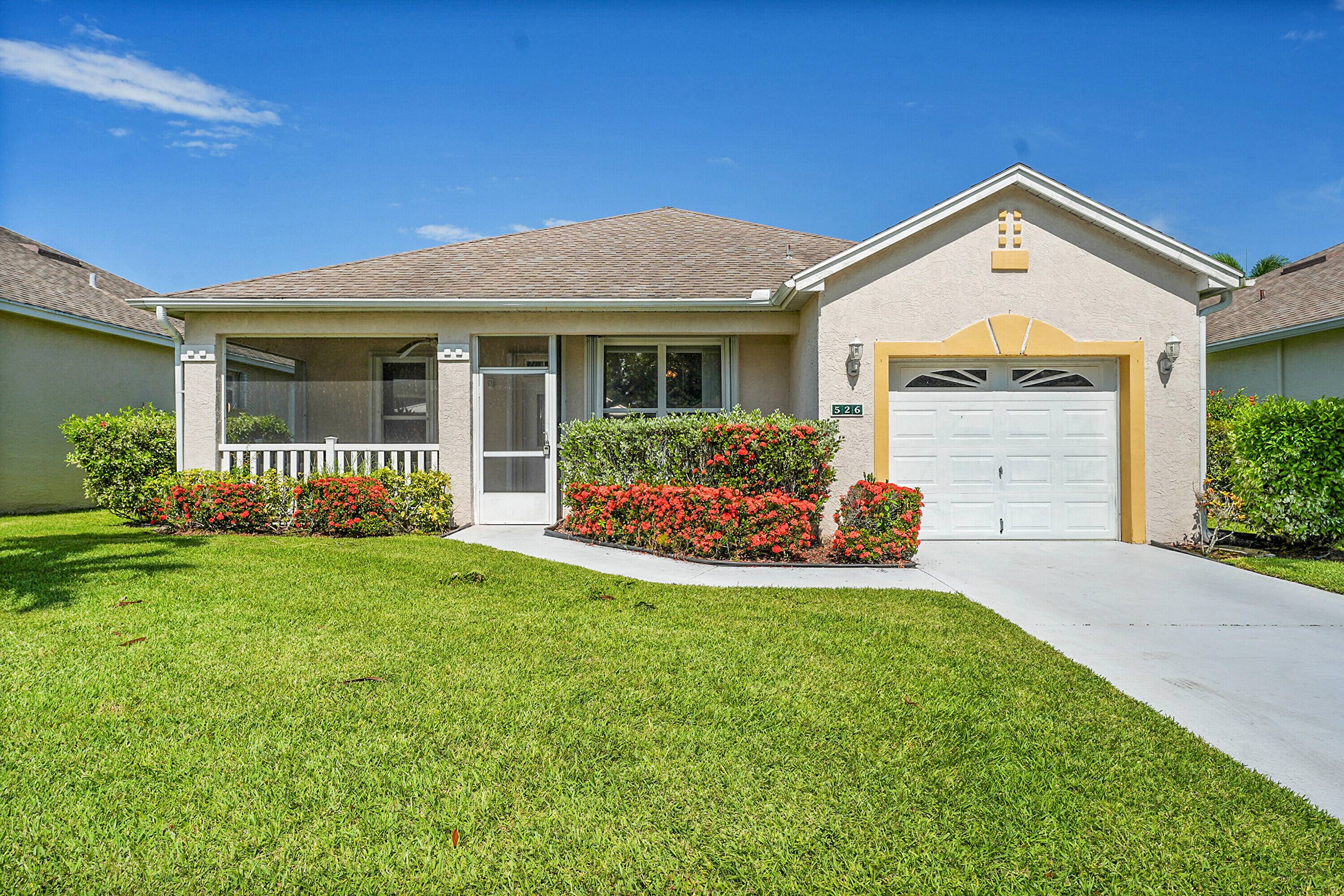 Welcome to your serene lakeside retreat in the active adult community of Kings Isle !