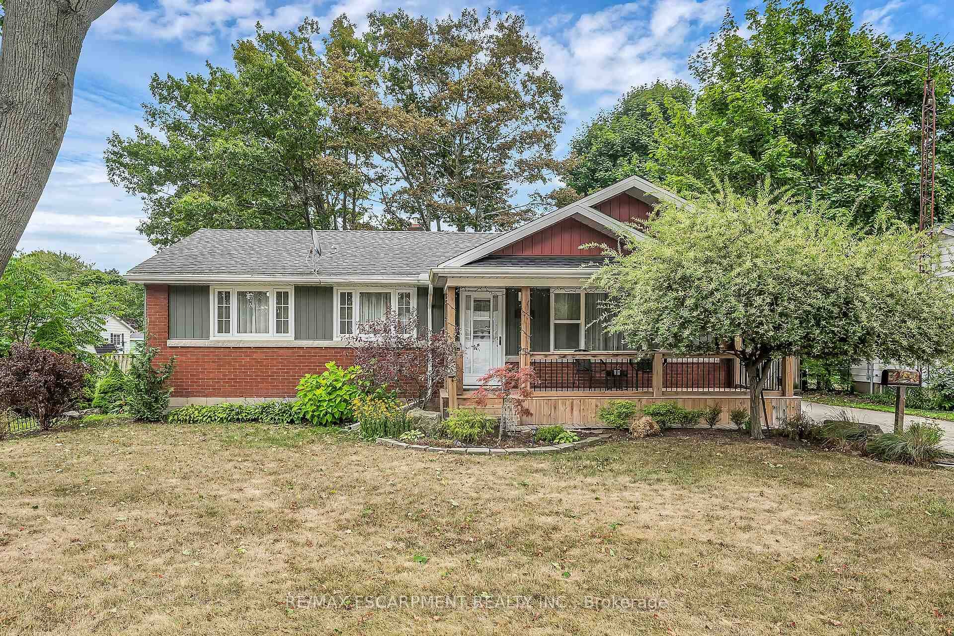 Solid, well maintained and updated bungalow on nice size lot with stunning curb appeal on a quiet street in the friendly town of Dunnvillle, includes bonus detached outbuilding.