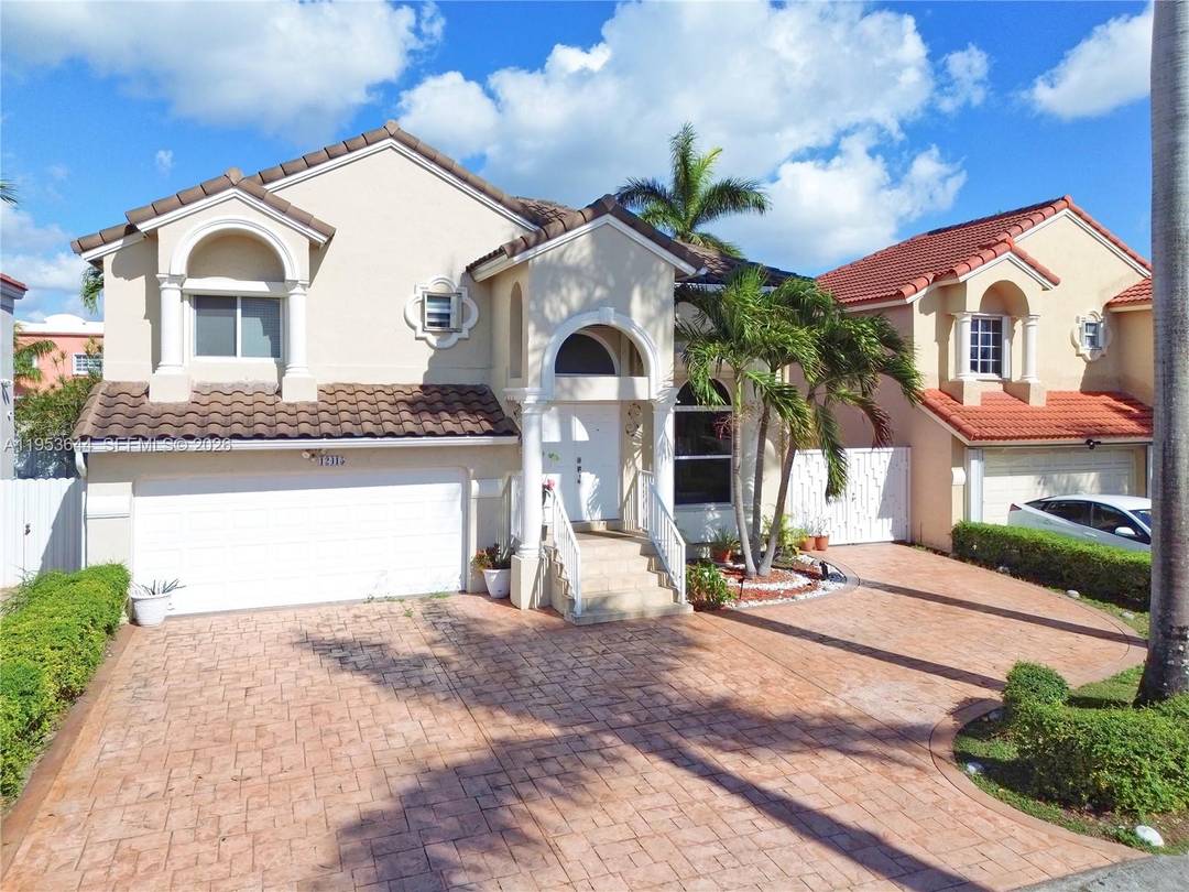 Stunning 4 bedroom, 3 bathroom residence featuring a convenient first floor bedroom with a full bathroom ideal for in law quarters or potential efficiency for additional income.