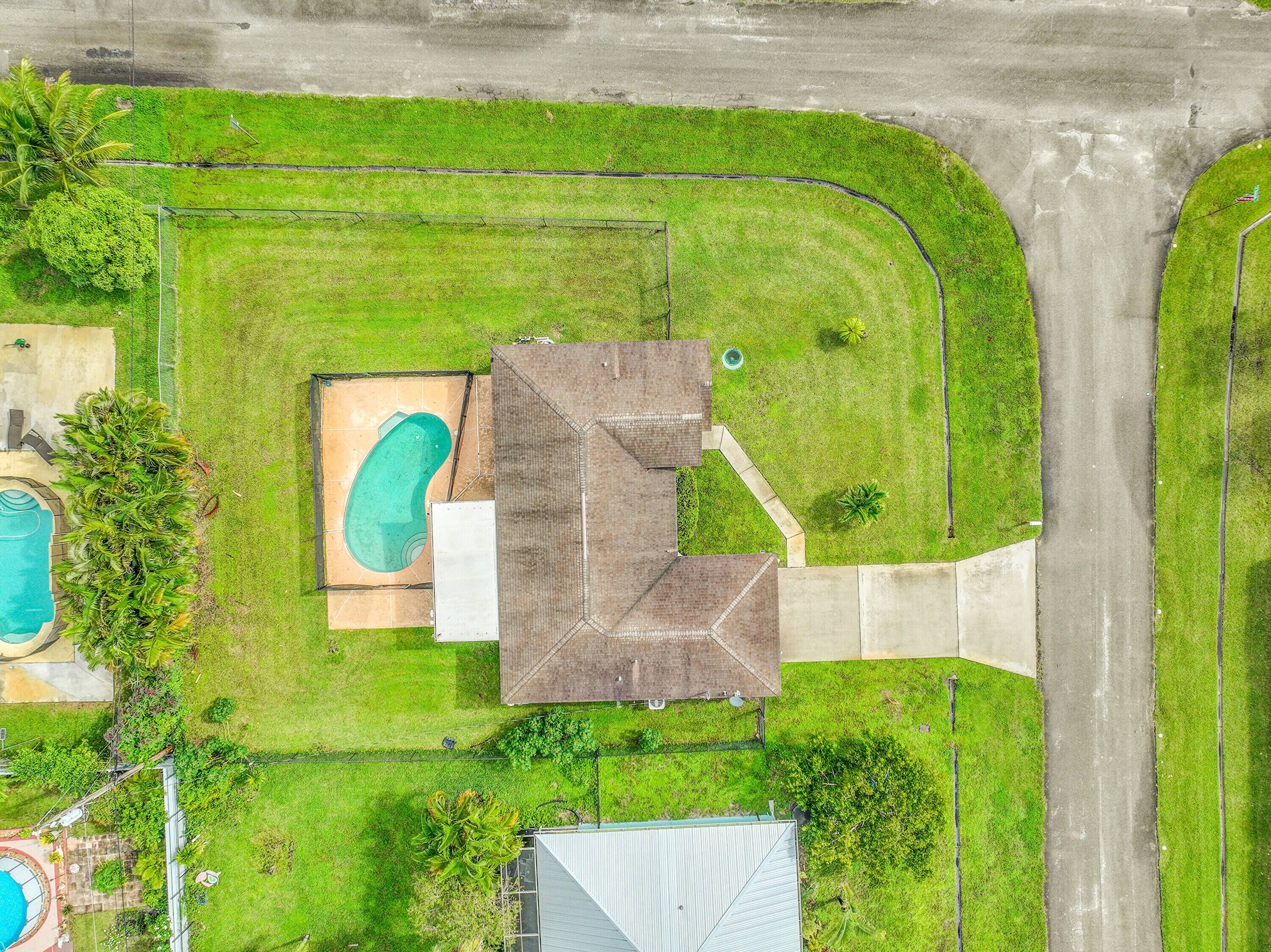 Spacious 3 bedroom, 2 bath CBS home on a desirable corner lot with a private inground pool and screened patio perfect for enjoying Florida living.