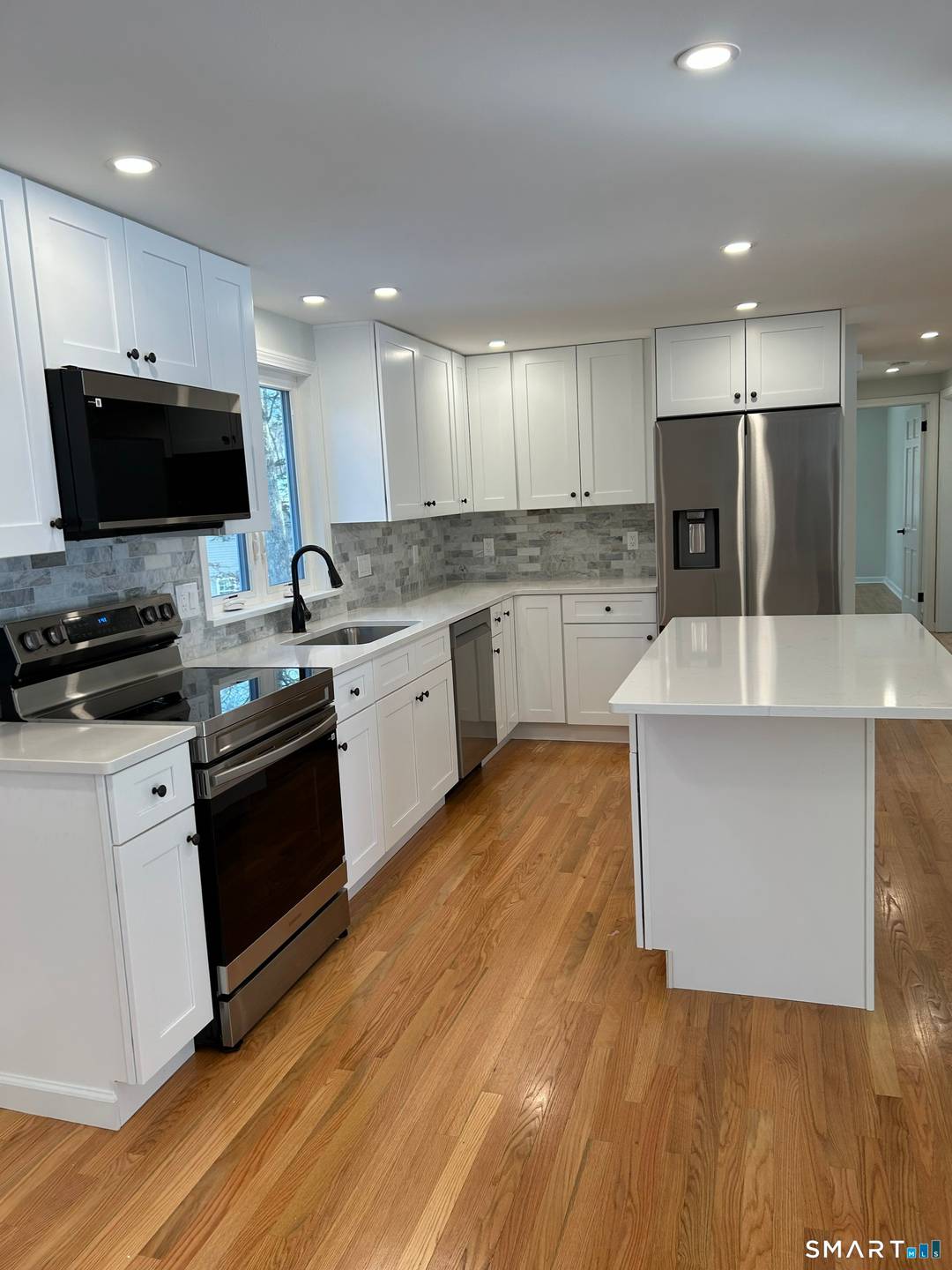 Set in a quiet, established neighborhood, this beautifully restored Dutch Colonial blends classic charm with thoughtful modern updates.