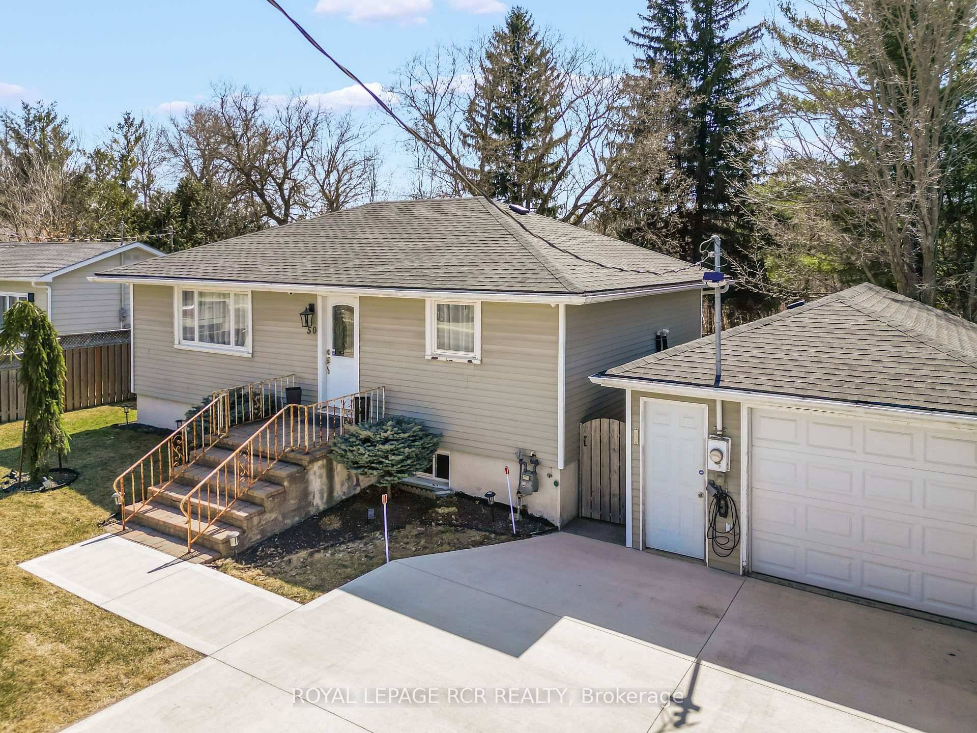 Set on the main street of Hillsburgh, this inviting bungalow perfectly blends comfort, convenience, and thoughtful upgrades.
